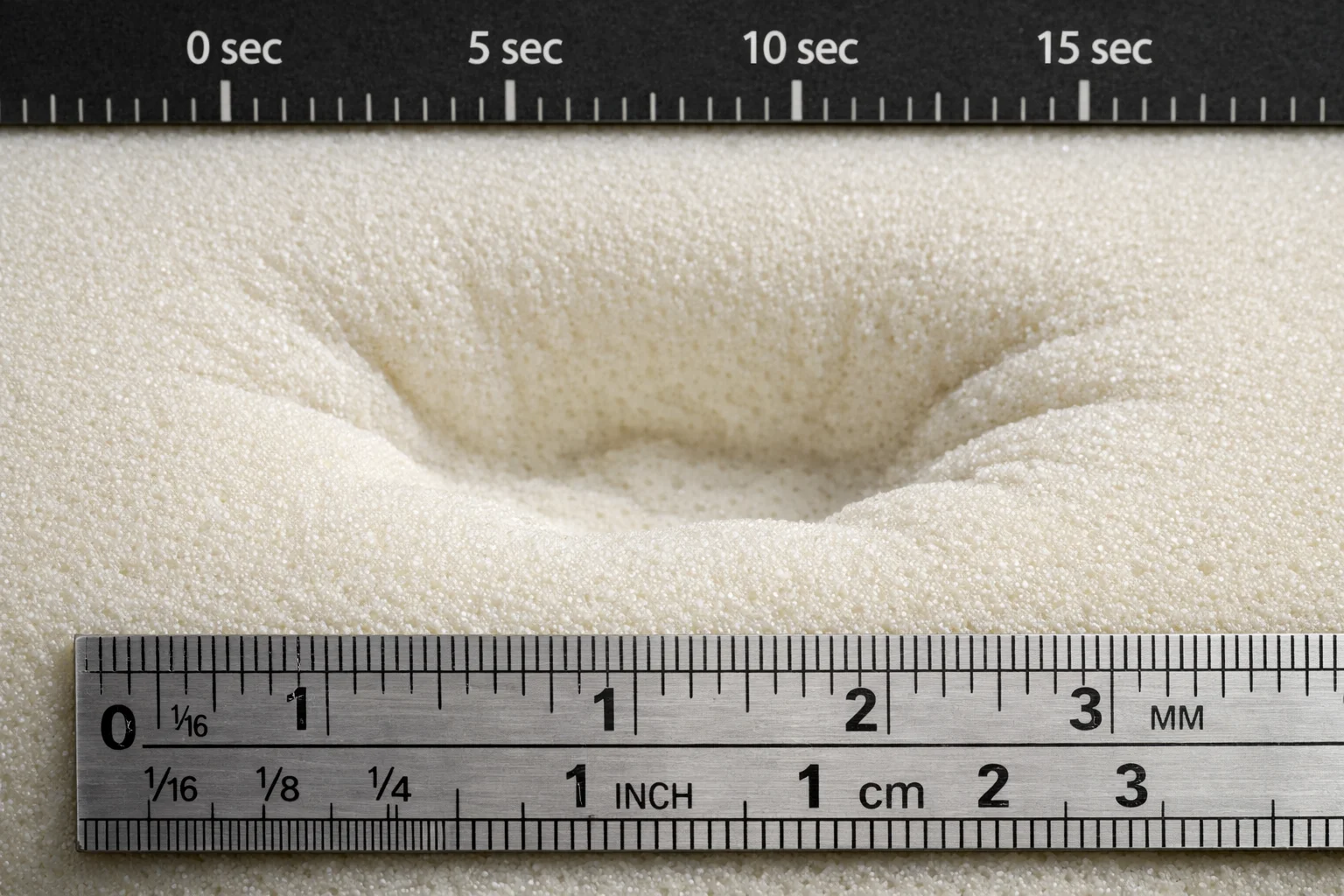Close-up of foam cushion showing delayed rebound after compression