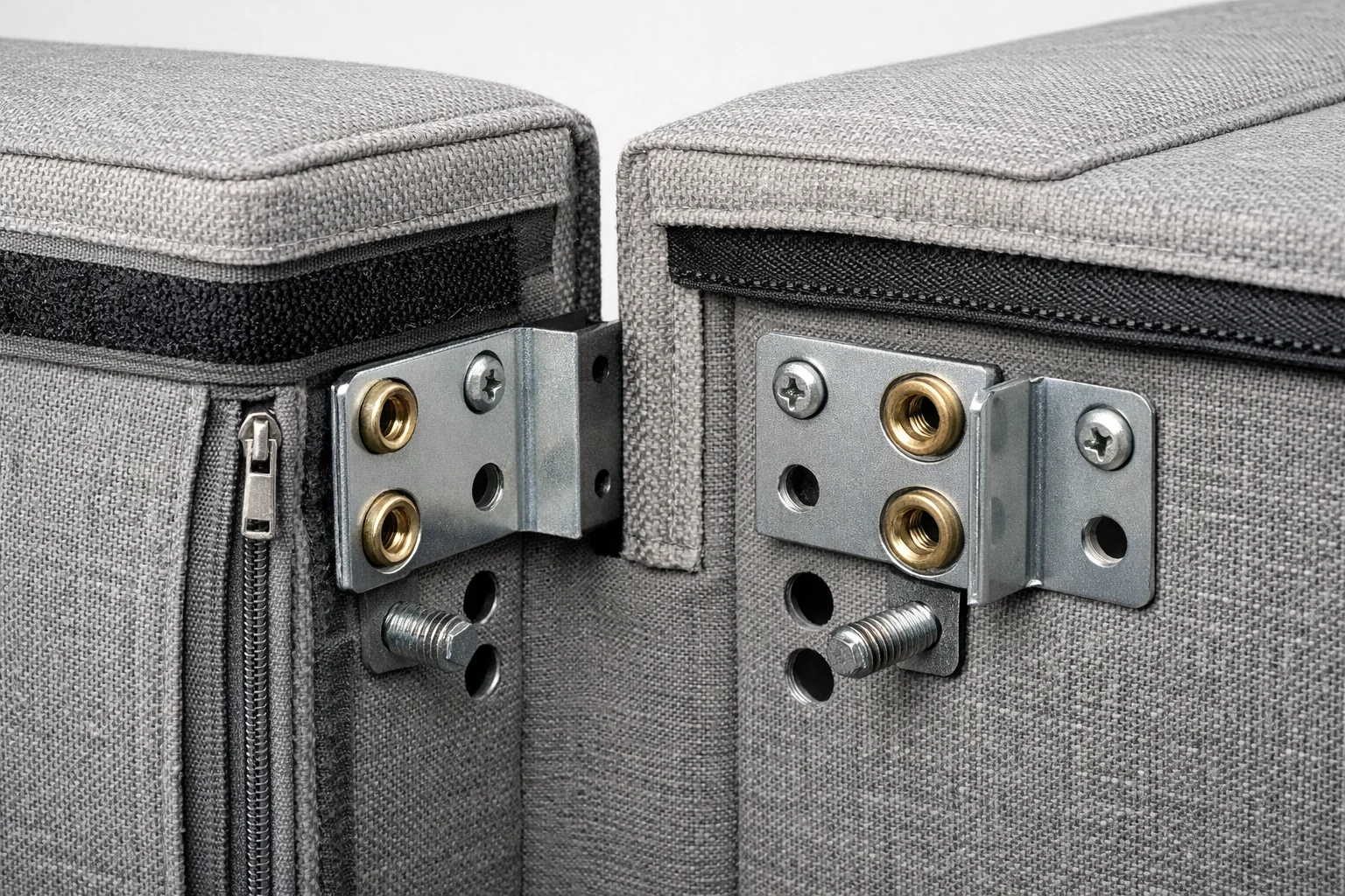 Close-up of a bolt-on sofa arm attachment showing mirrored mounting points for left-to-right swapping