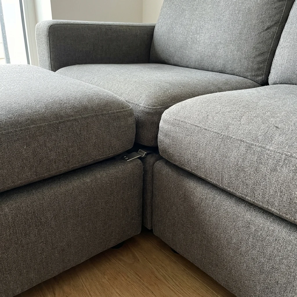 Close up of a misaligned modular sofa seam