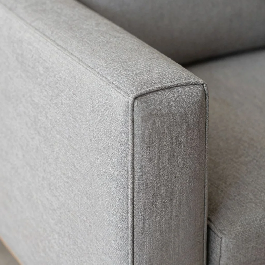 Close up of upholstery stitching showing straight piping versus wavy piping